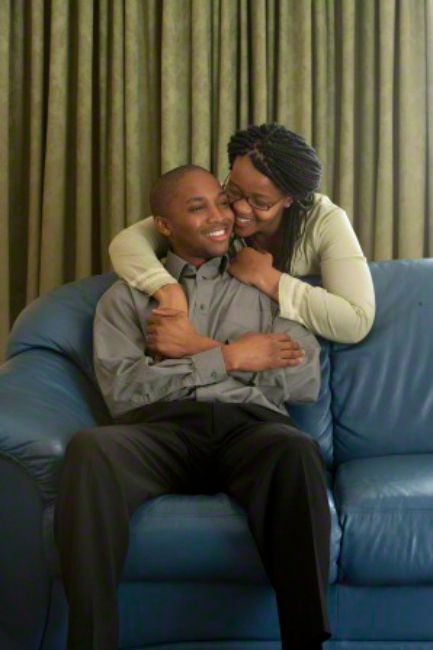 Couple hugging on couch