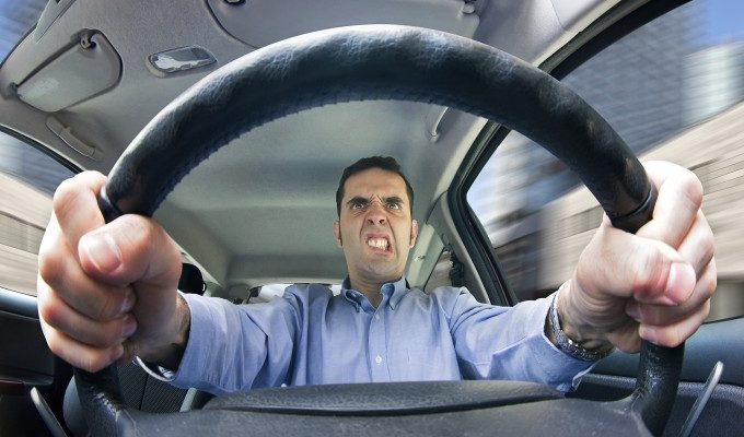 Man driving angrily