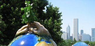 Statue of planting a tree on planet Earth