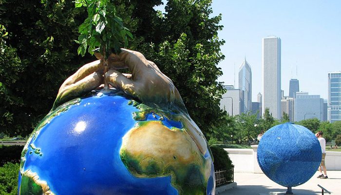 Statue of planting a tree on planet Earth