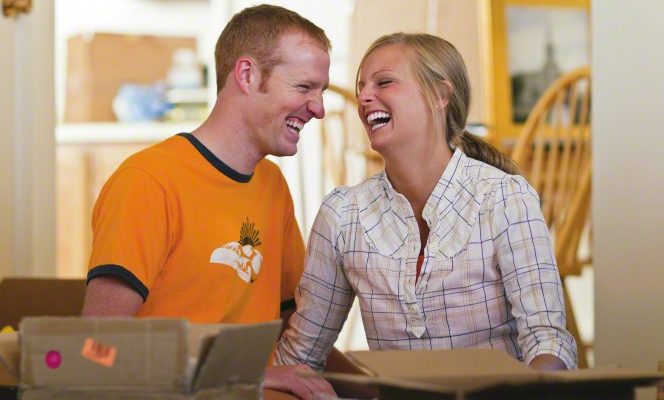 happy young couple in a new house