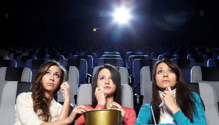 3 women watch a sad movie