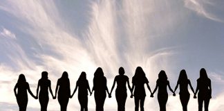 Silhouette of a line of women holding hands