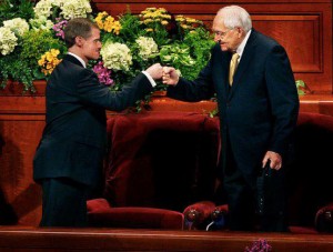 Elder Bednar and Elder Perry fist bumping after General Conference