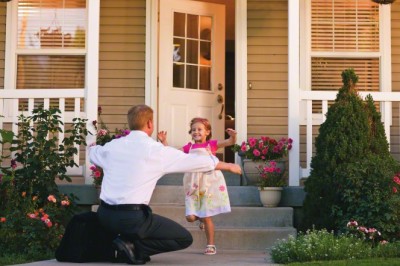 father greeting young daughter