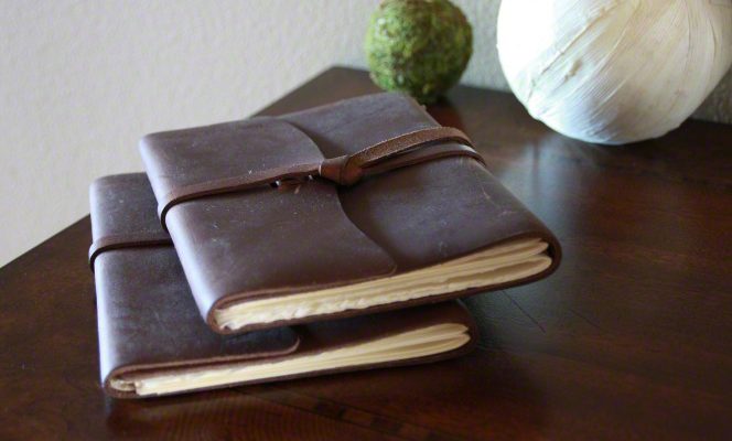 Leather bound journals on a desk