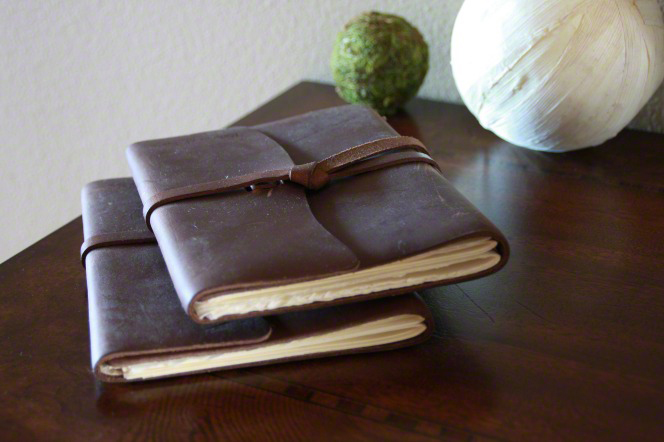 Leather bound journals on a desk