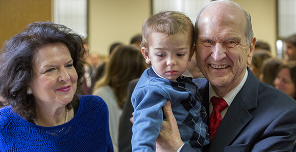 Elder and Sister Nelson visit church members in Brazil.