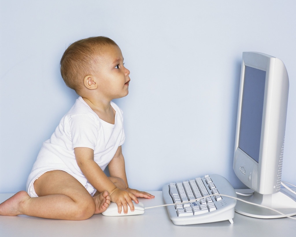 baby using a desktop computer