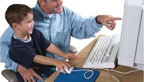 father and son on the computer
