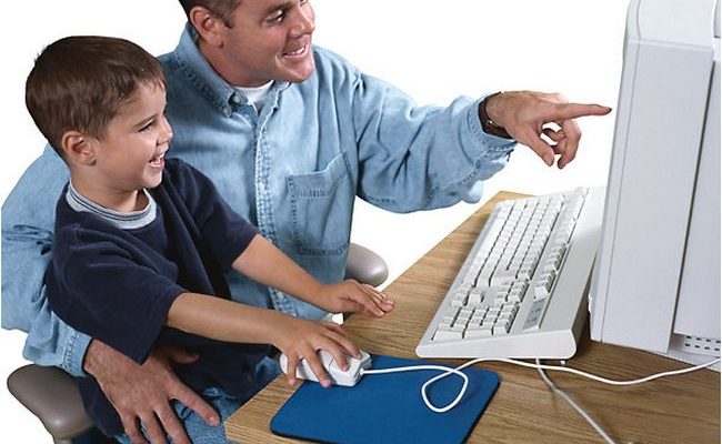 father and son on the computer