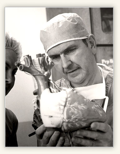 Dr. Nelson examines a model of the human heart