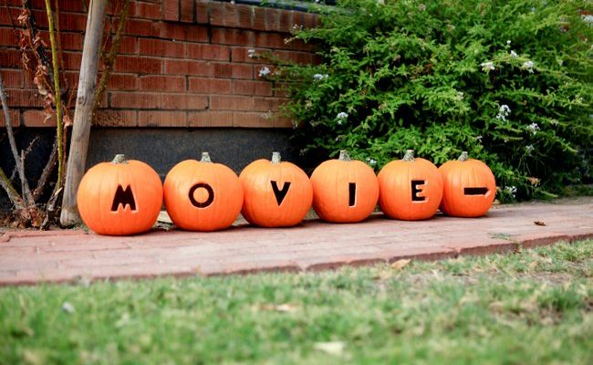 Directions to Halloween Movie Night carved in Pumpkins