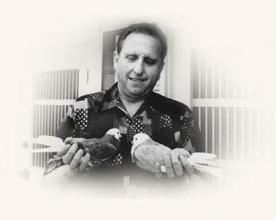 Thomas S. Monson holding two of his pigeons