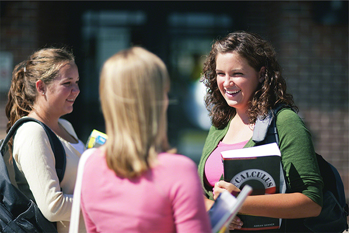 High school students speak to one another