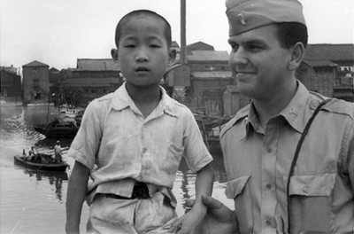 Russell M Nelson and a Korean boy