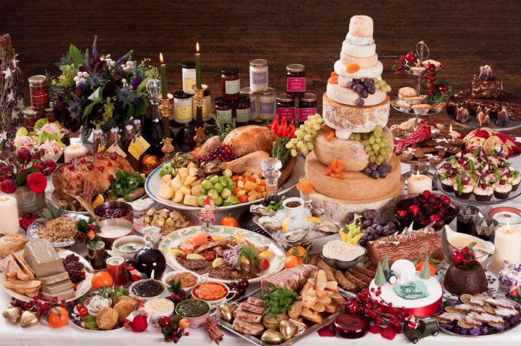 Dining table set with Christmas foods from around the world. 