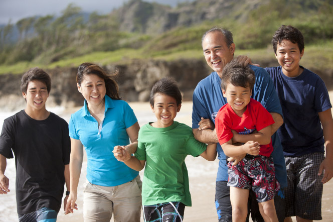 Family enjoying time together on the beach