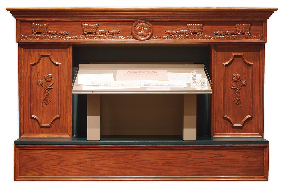 Fire place hand carved by President Packer. Image via LDS.org.