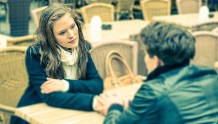 Young woman and young man talking