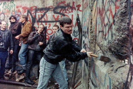 Behind the Wall: Then & Now” – change to, “East German citizens assist in breaking down the Berlin Wall with mallets