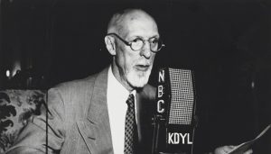 George Albert Smith talks on the microphone