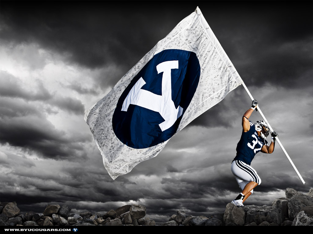 BYU football player raising flag