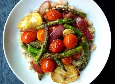 a dish of sautéed fruits and vegetables on a bed of rice