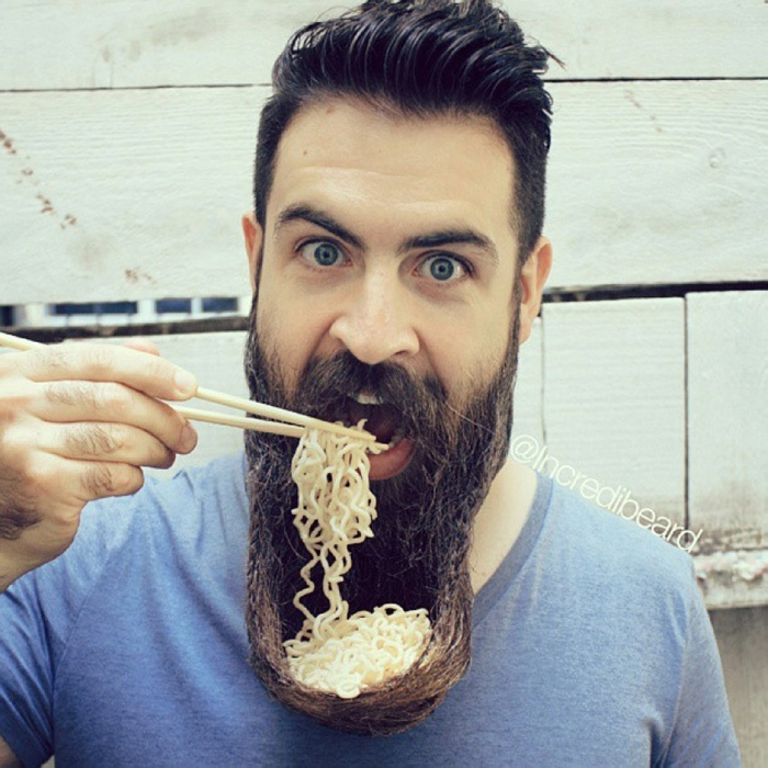 Man using his beard as a bowl for his food