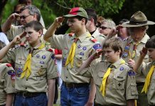 Boy scouts saluting