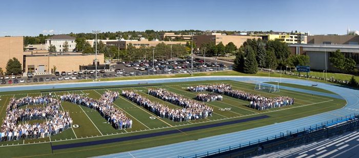 Photo of hundreds of BYU-Idaho students forming BYU-I for a tenth anniversary picture