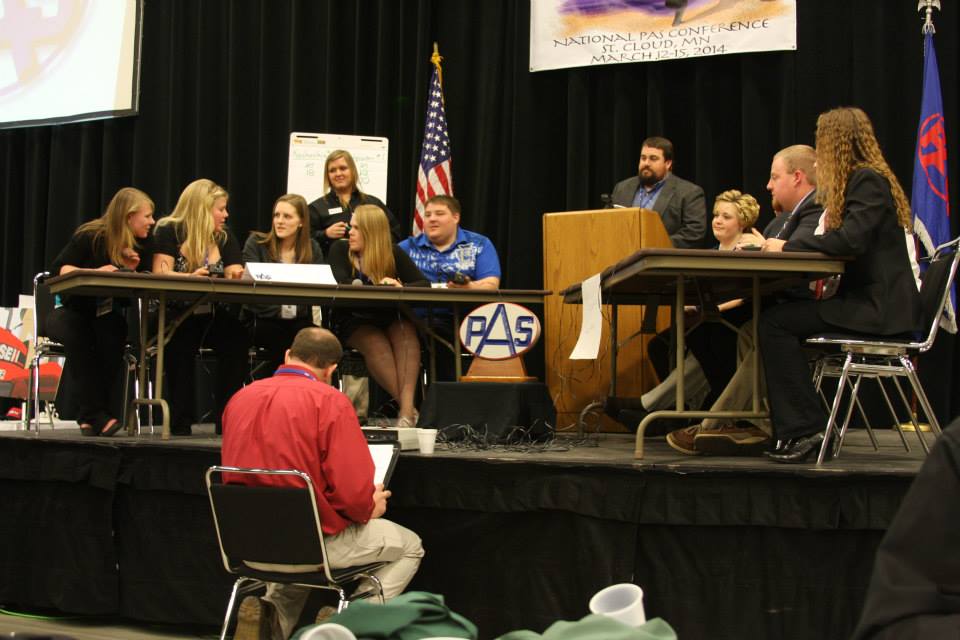 Two teams of students debating at an agricultural competition