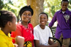 Mother and children sitting on a bench