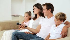 Family of four watching TV