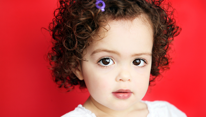 Little Girl on Red Background