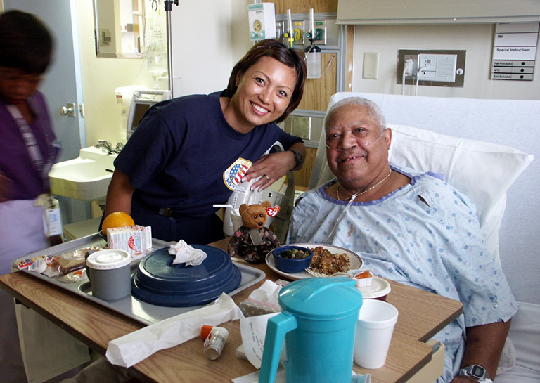 Jonnalynn Cummings visits with Air Force veteran Leon Gilbert at Chicago's Westside VA Hospital