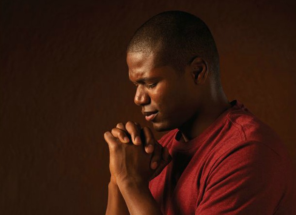 A man turning to the Lord in prayer