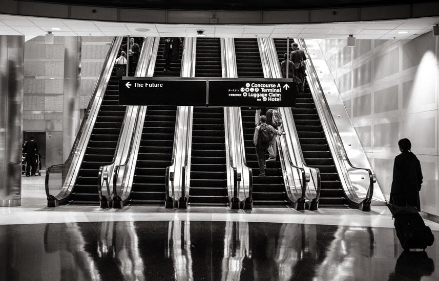 Returning missionary choosing which escalator to go up.