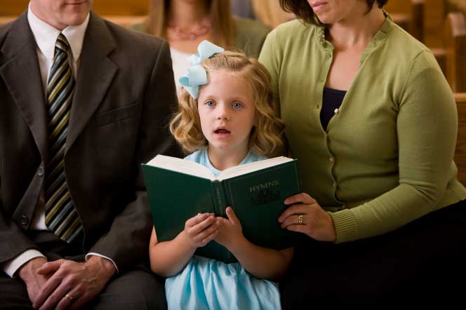 Little girl singing the hymns