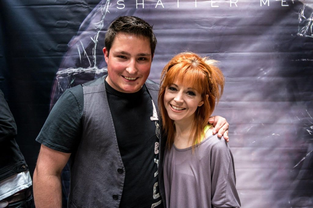 Lindsey Stirling poses with Matt Janovsky after a concert