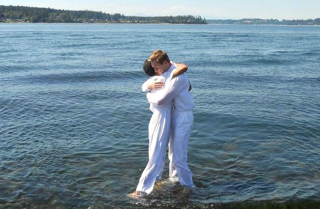 Man rejoicing after being baptized