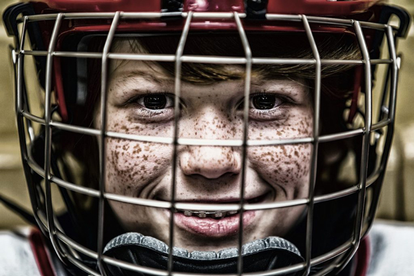 Boy in his intramural hockey team uniform.