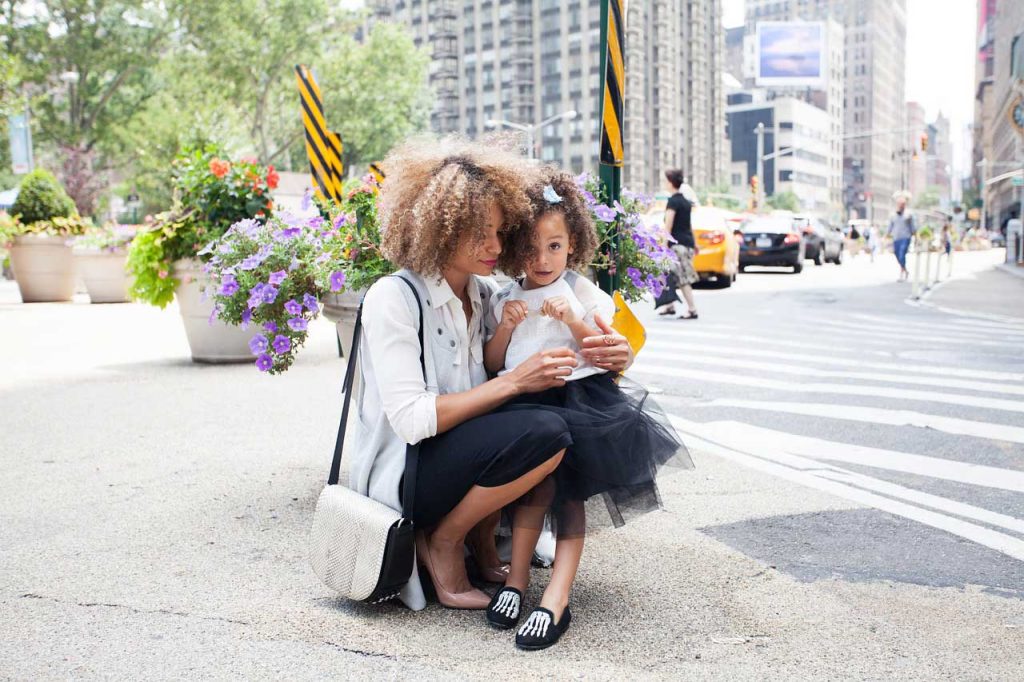 Mother holding daughter