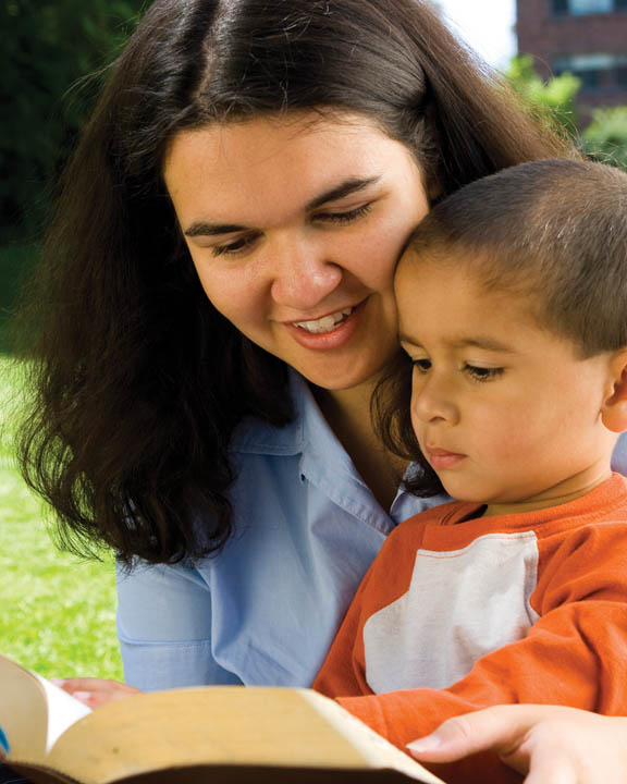 Mother reading to boy