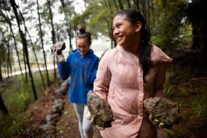 Youth participating in a service project to further ward missionary work.