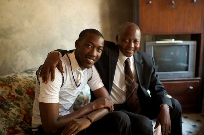 father and son sit together