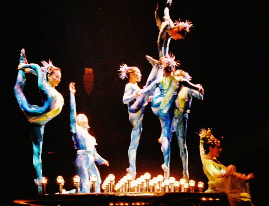 Cirque du Soleil gymnasts and contortionists performing.