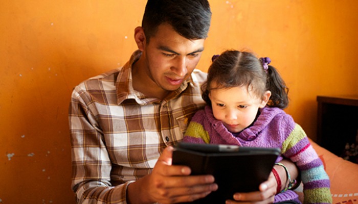 father and daughter reading