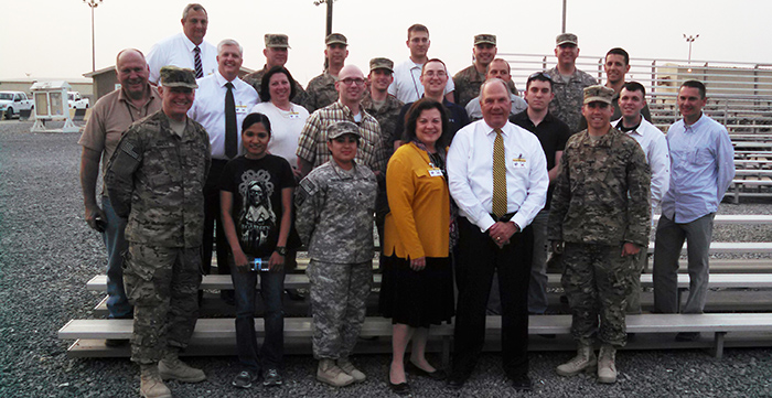 Elder Ronald A. Rasband and Sister Melanie Rasband with LDS personnel at Camp Arifjan, Kuwait.