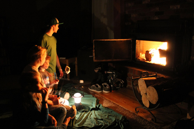 Family roasting marshmallows in power outage